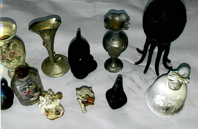 Heavy Smoke and Soot Damage on Decorative Items Before Restoration